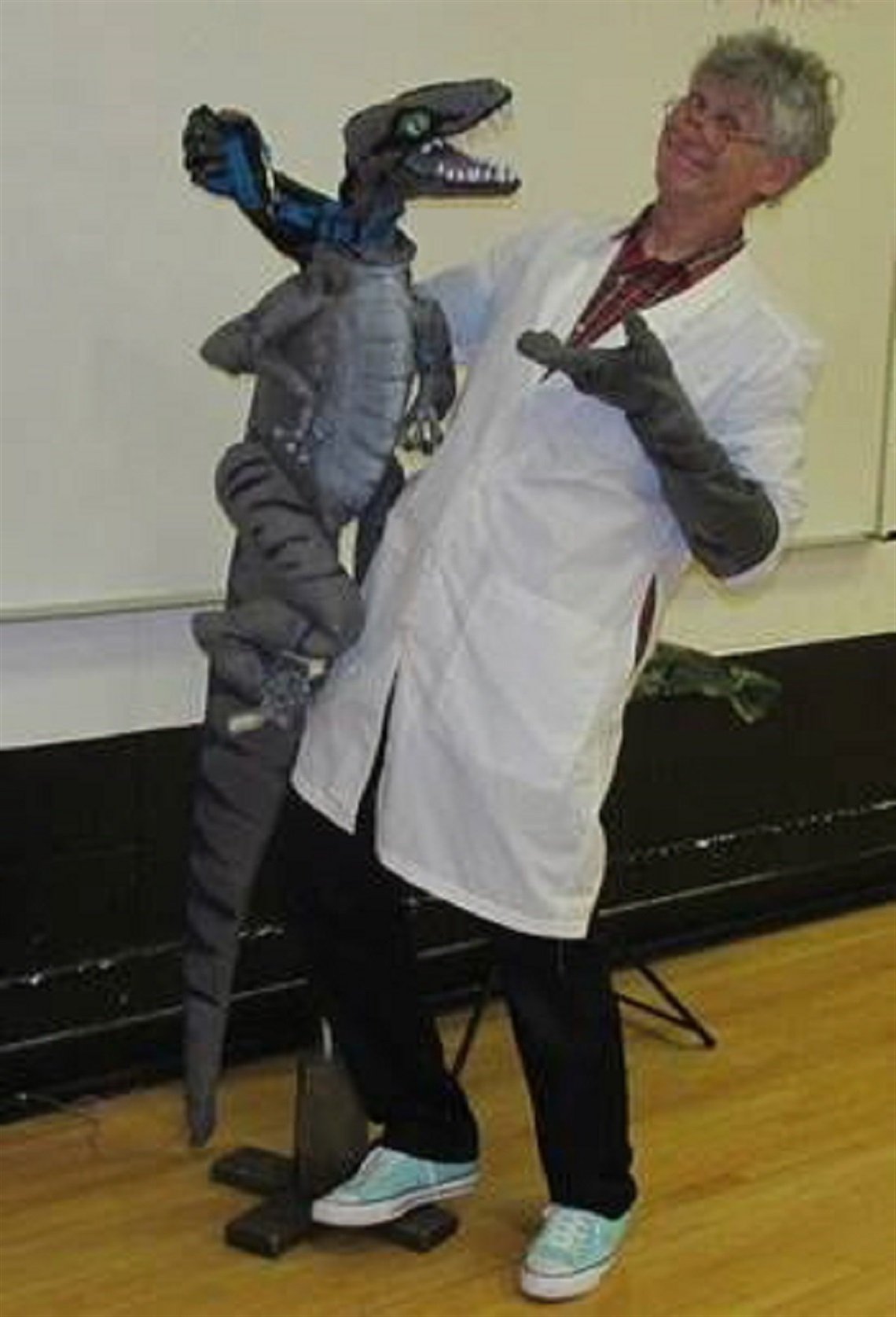 Man with dinosaur puppet.jpg