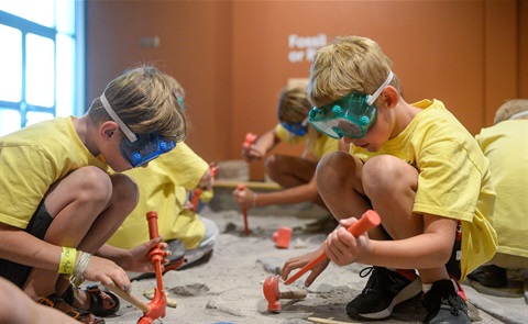 children digging for fossils in sand.jpg