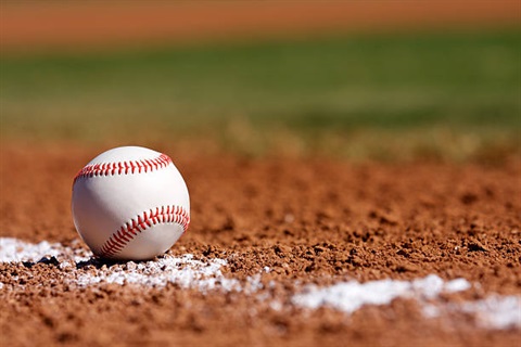 baseball lying on the infield 