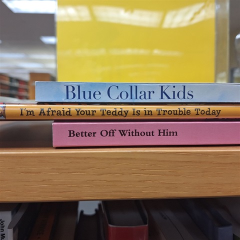 books spines displaying blue collar kids, i'm afraid your teddy is in trouble today, better off without him