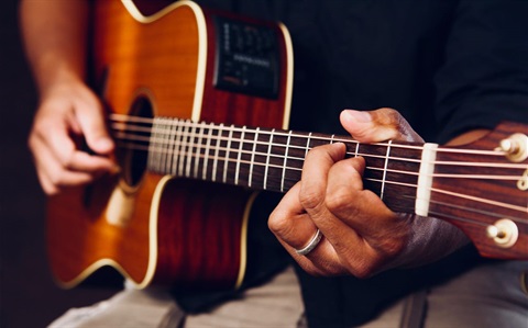 someone holding a guitar